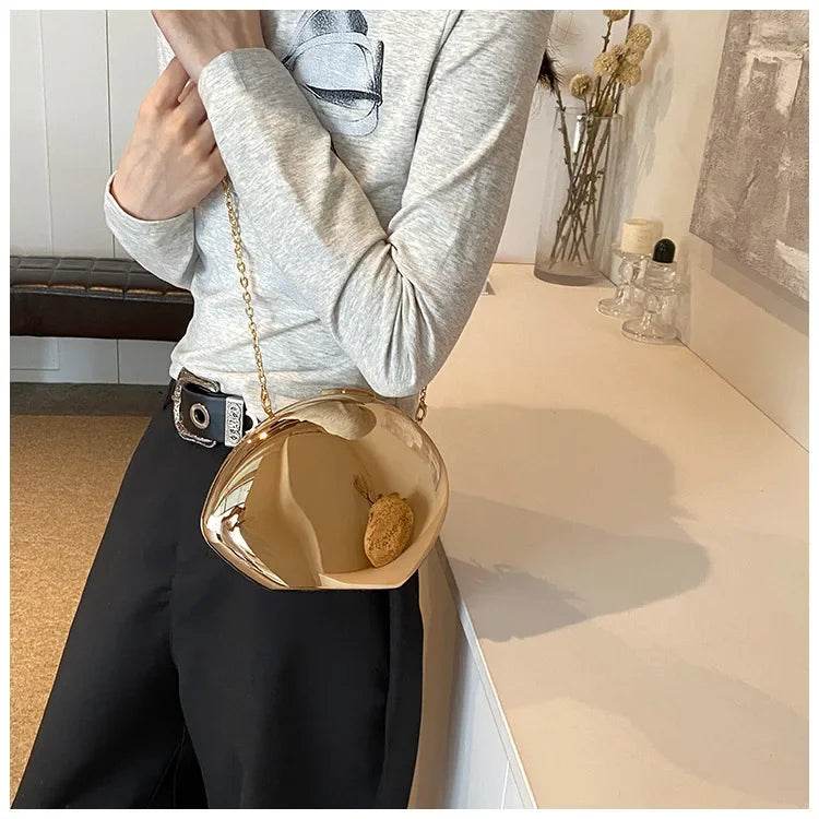 Stylish VaultHaus Acrylic Shell Shape Clutch Bag with a Gold Finish and Chain Strap for Elegant Outings