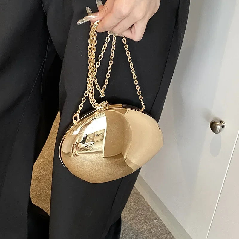 Stylish VaultHaus Acrylic Shell Shape Clutch Bag with a gold finish and chain strap for a chic look