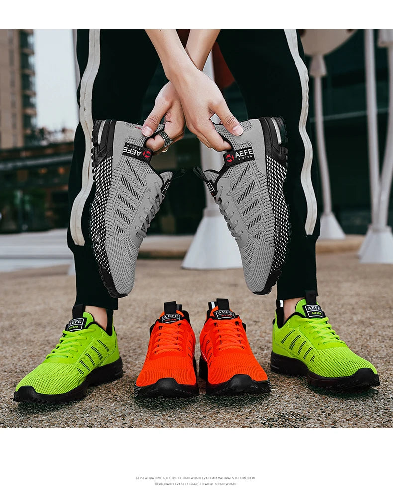 VaultHaus lightweight athletic sneakers for men in gray, neon green, and bright orange colors displayed outdoors