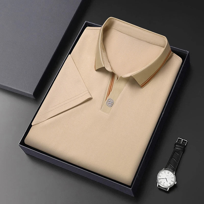 VaultHaus business casual polo top neatly folded in a gift box next to a stylish watch