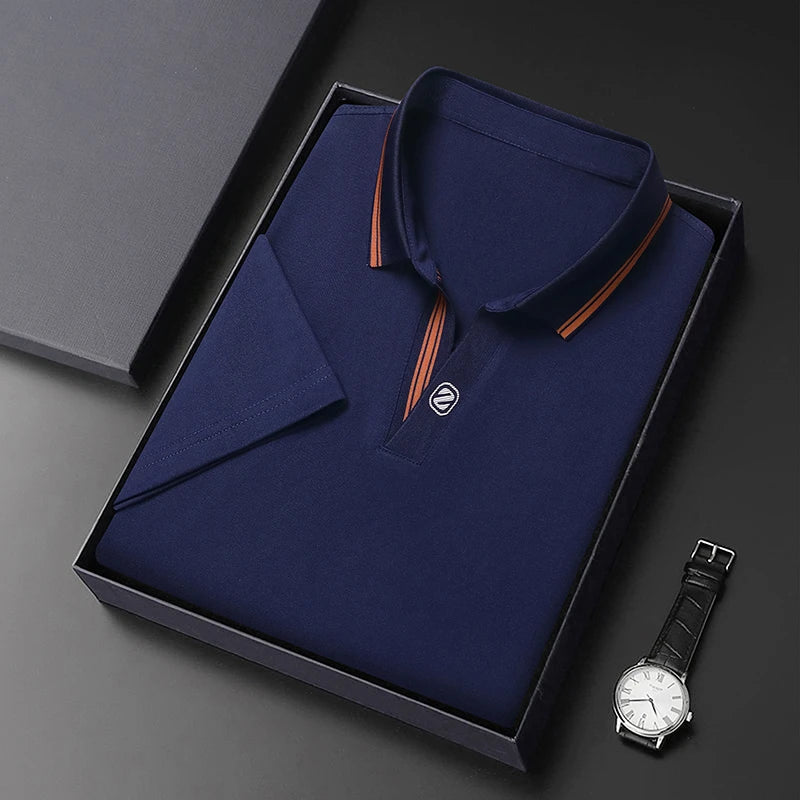 Navy VaultHaus business casual polo top neatly packaged in a box with a stylish watch
