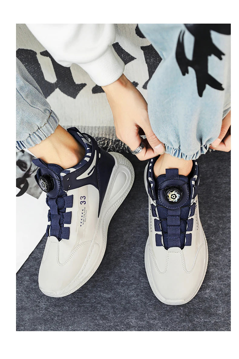 VaultHaus comfortable non slip lace up men's sneakers in white and navy being worn with casual jeans