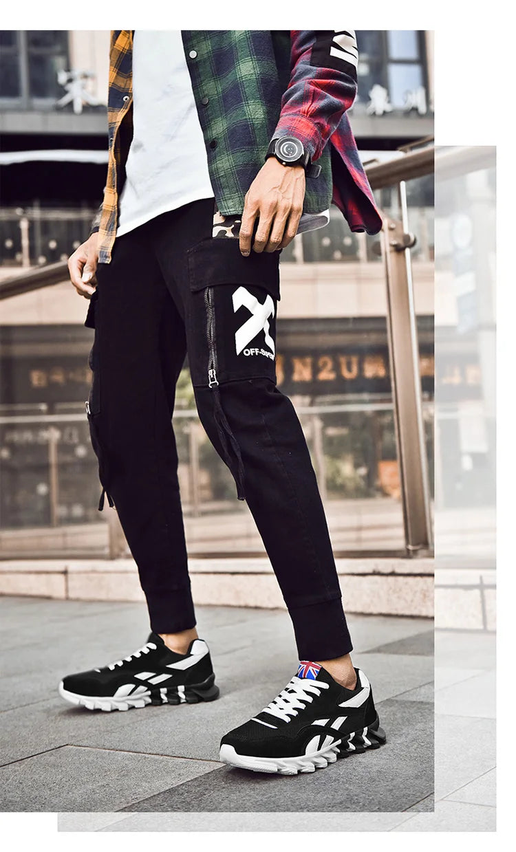 VaultHaus comfortable unisex walking sneakers worn with stylish black joggers and plaid shirt