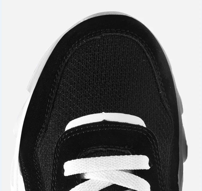 Top view of VaultHaus comfortable unisex walking sneakers in black and white with classic lace design