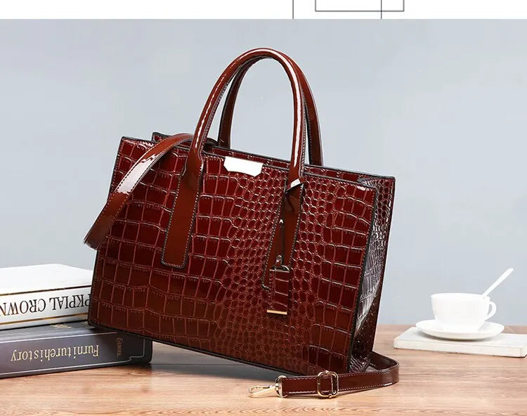 Stylish VaultHaus crocodile print tote bag in dark brown with dual handles and adjustable strap