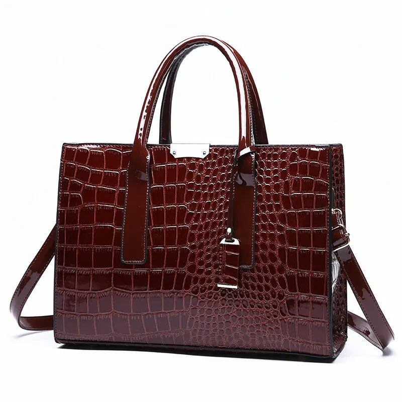Stylish burgundy crocodile print tote bag with dual handles and detachable shoulder strap