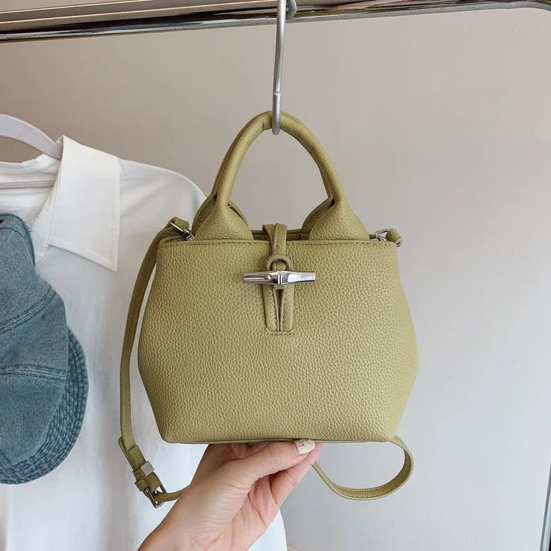 VaultHaus designer women's leather shoulder bag in textured olive green with silver clasp and adjustable strap