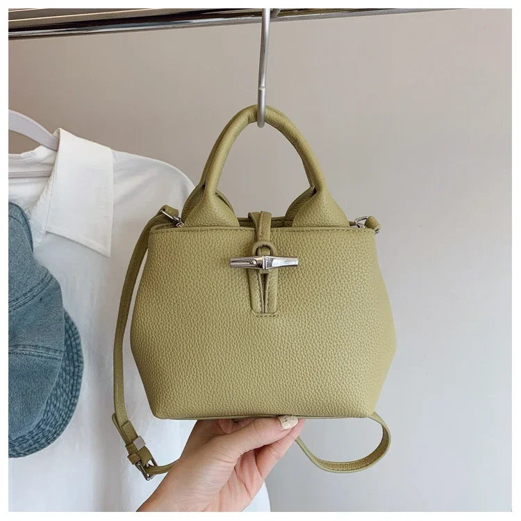 VaultHaus designer women's leather shoulder bag in light olive green with silver hardware and adjustable strap