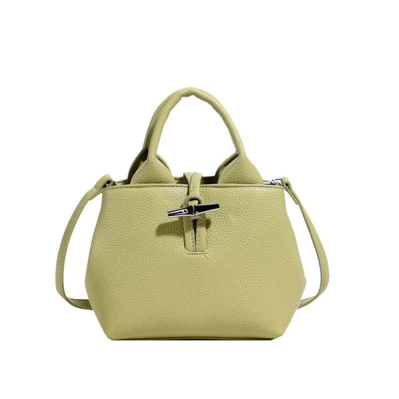 VaultHaus designer women's leather shoulder bag in light green with textured finish and top handles