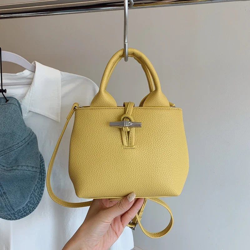 VaultHaus yellow designer women's leather shoulder bag with textured finish and silver clasp
