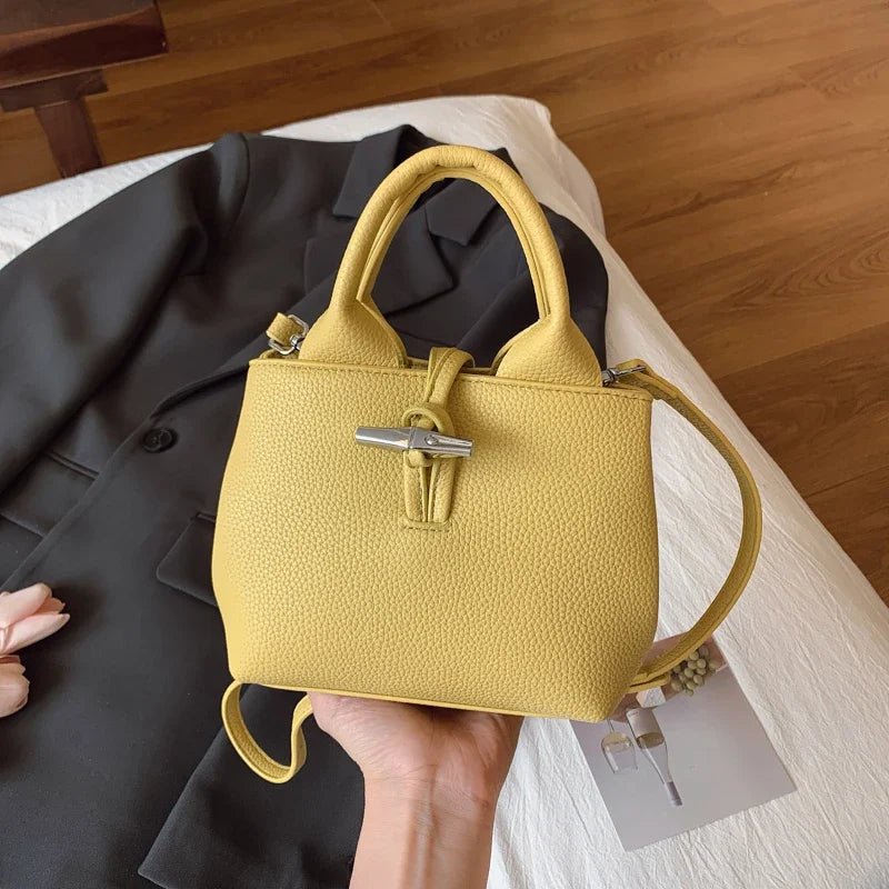 VaultHaus designer women's leather shoulder bag in yellow with textured finish and silver buckle