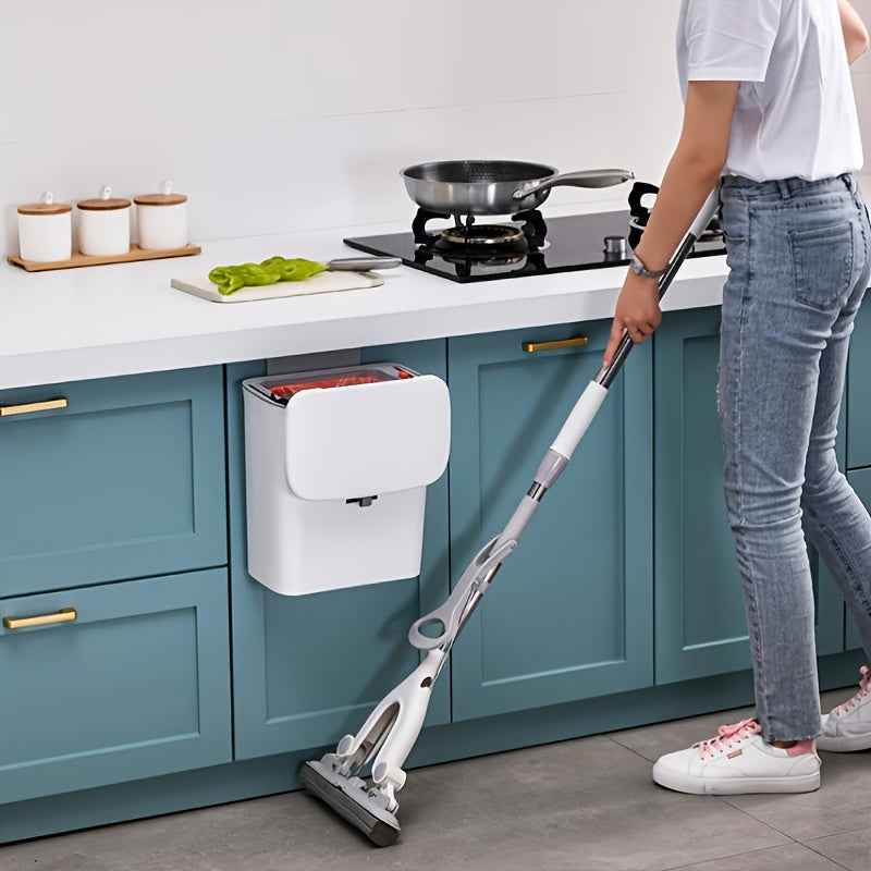 Stylish kitchen with a person using a mop near a Door Hanging Trash Can for efficient cleanup