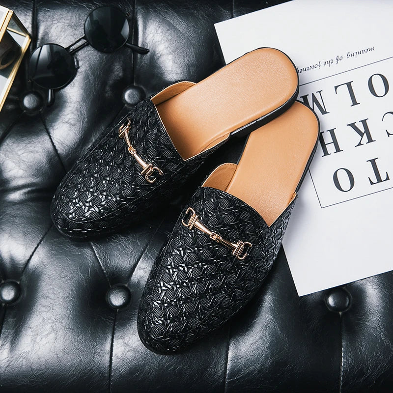 VaultHaus black textured leather fashion mules for men with gold buckles on black leather surface