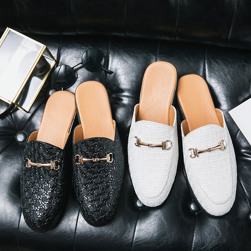 VaultHaus black and white fashion mules for men with textured design and metal buckle detail on black leather surface