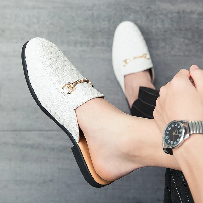 white fashion mules for men with textured pattern and gold buckle detail.