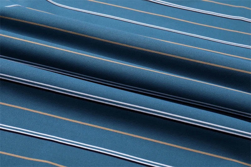 Close-up of VaultHaus business casual short sleeve polo in blue with stylish stripes