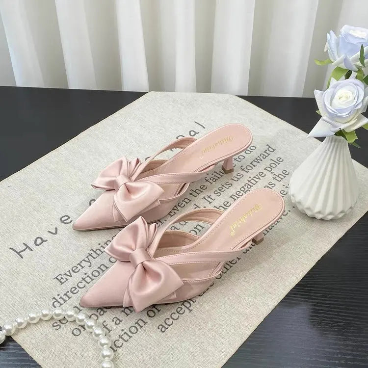 French style pink slippers with a charming bow detail and sleek design for stylish comfort
