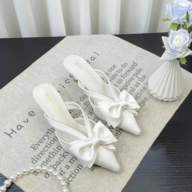 Elegant VaultHaus French style pink slippers with a bow for a chic look