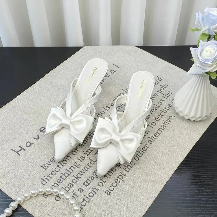 Elegant French style pink slippers with bow detail for chic and comfortable wear