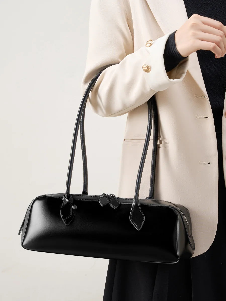 Stylish black ladies baguette shoulder bag with elegant handles for a chic look