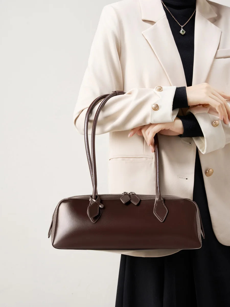 Stylish brown ladies baguette shoulder bag with elegant design and comfortable straps