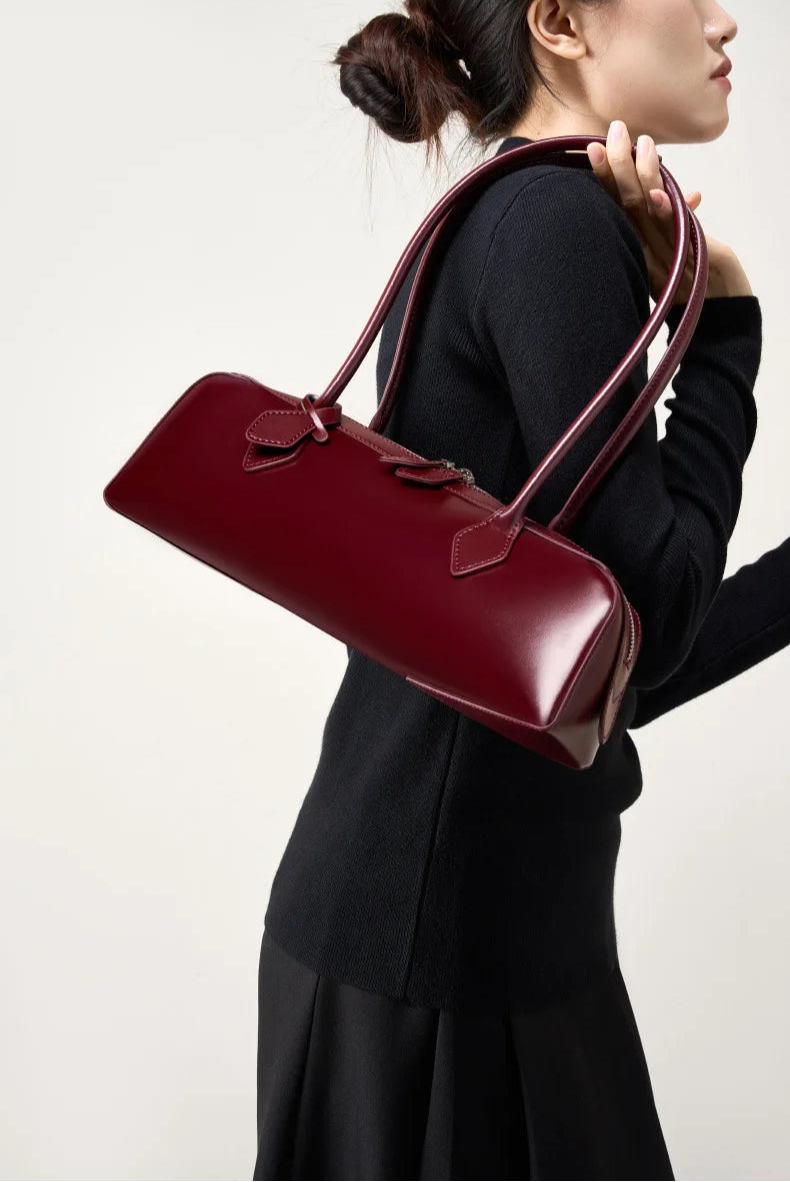 Stylish ladies baguette shoulder bag in burgundy with a classic diamond shape design for everyday use