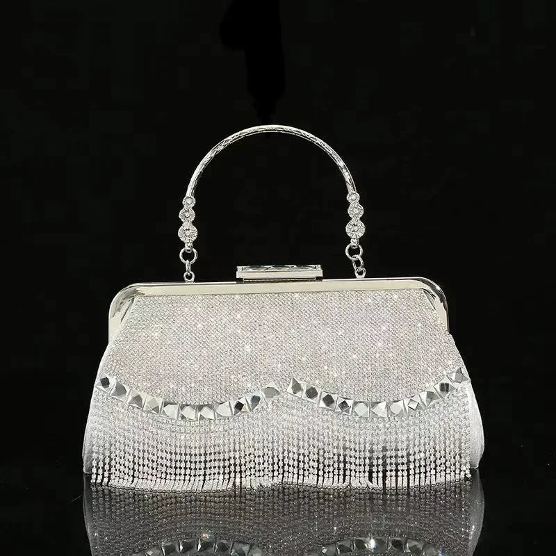 Elegant silver ladies luxury evening purse with sparkling fringe and a stylish handle