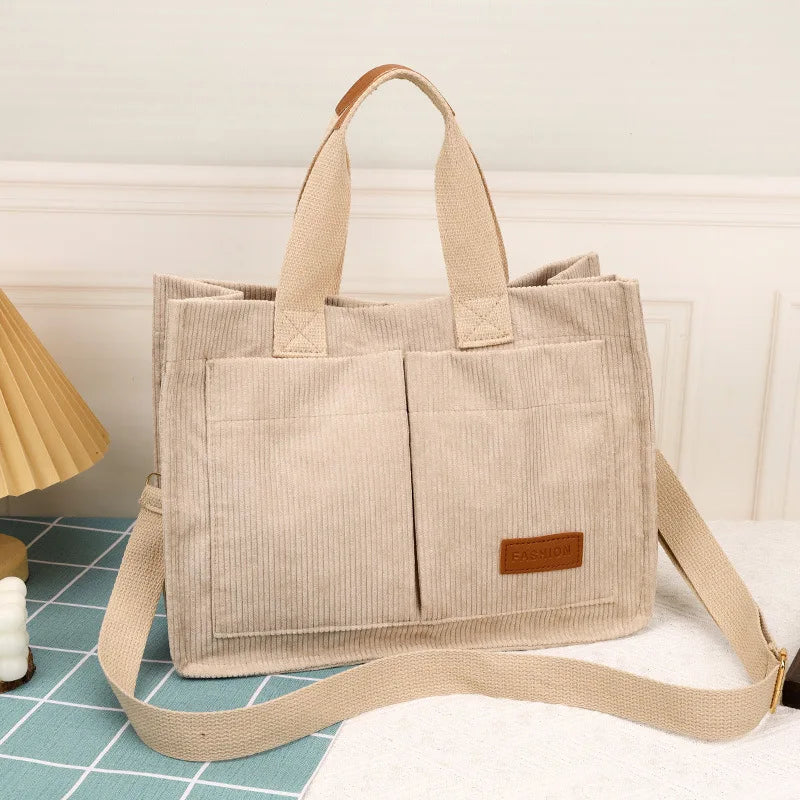 VaultHaus large capacity canvas handbag in beige with dual front pockets and adjustable strap