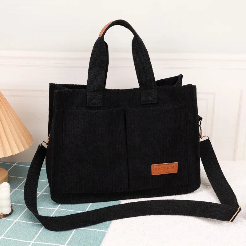VaultHaus large capacity canvas handbag in black with stylish design and adjustable strap