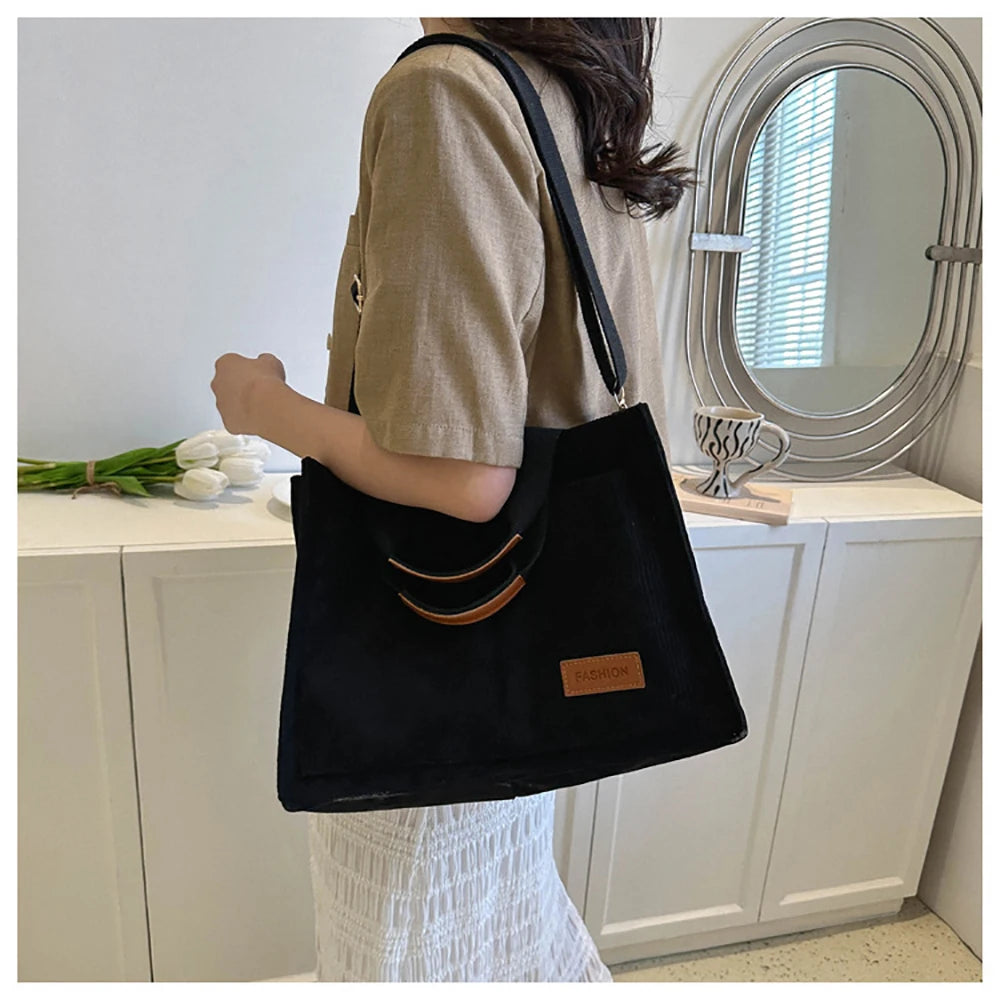 Stylish large capacity canvas handbag from VaultHaus with a sleek design and comfortable shoulder straps