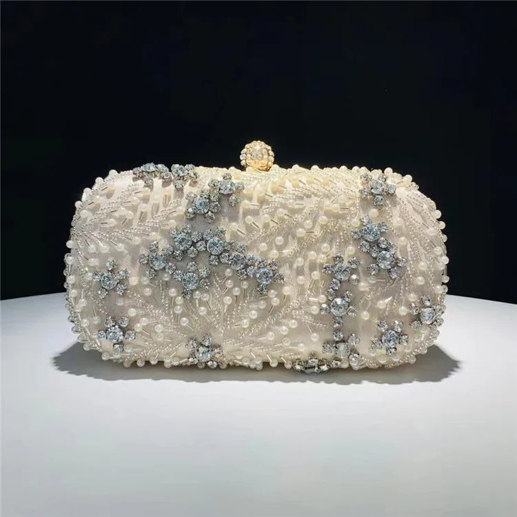 VaultHaus pearl embellished evening clutch bag with intricate bead and crystal detailing on white fabric