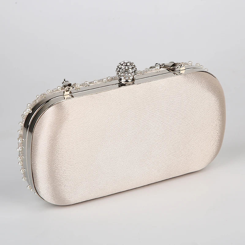 VaultHaus pearl embellished evening clutch bag in ivory with silver frame and decorative clasp
