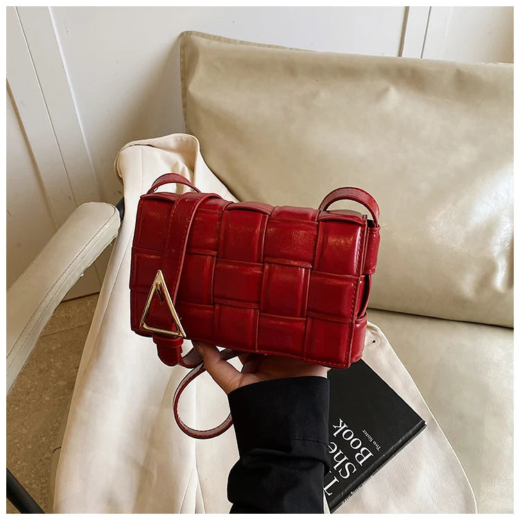 VaultHaus women's designer shoulder bag in red woven leather with gold triangle buckle detail