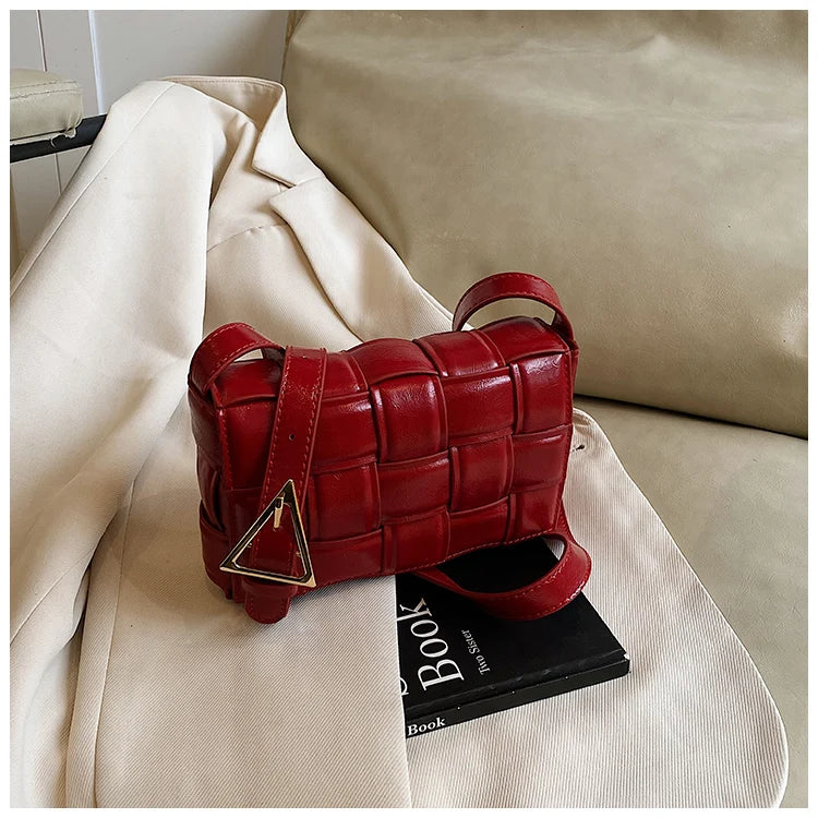 VaultHaus women's designer shoulder bag in red woven leather style with adjustable strap on beige fabric