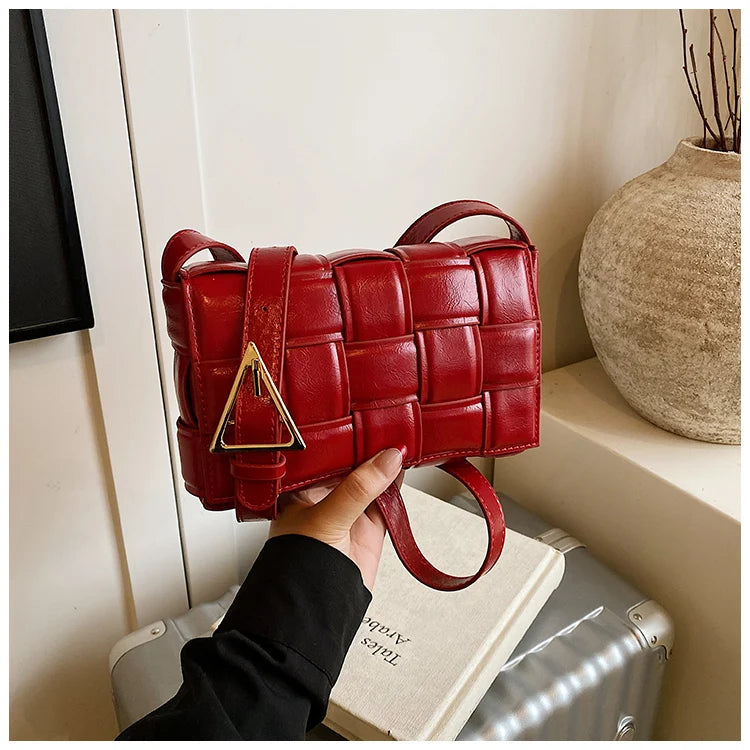 VaultHaus women's designer shoulder bag in red leather with woven pattern and gold buckle detail