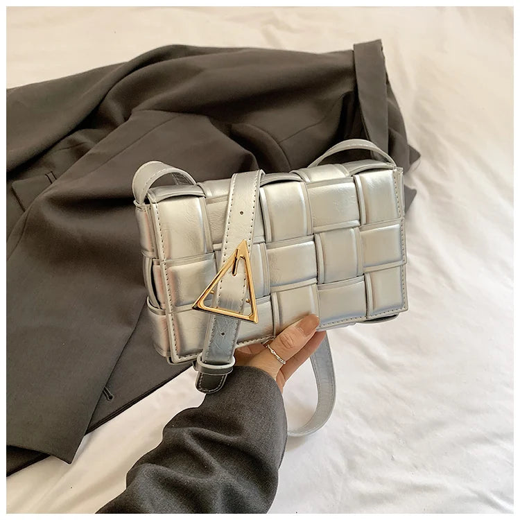 VaultHaus women's designer shoulder bag in silver with woven texture and gold triangle buckle