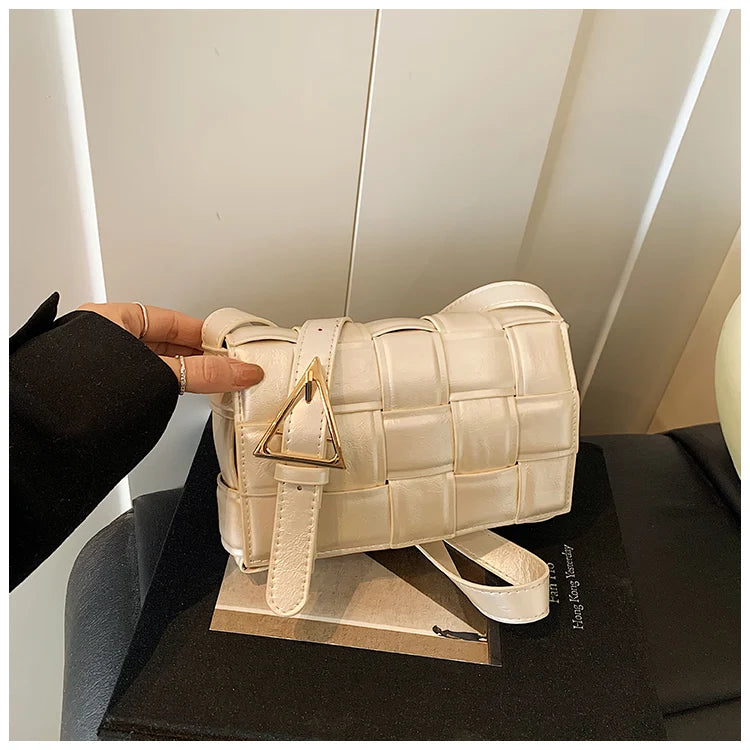 VaultHaus women's designer shoulder bag in cream with woven pattern and gold triangle buckle