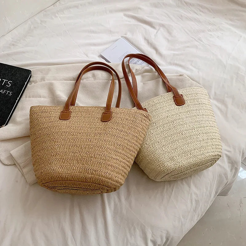 Luxury woven shopper tote bags in beige and cream with brown leather handles