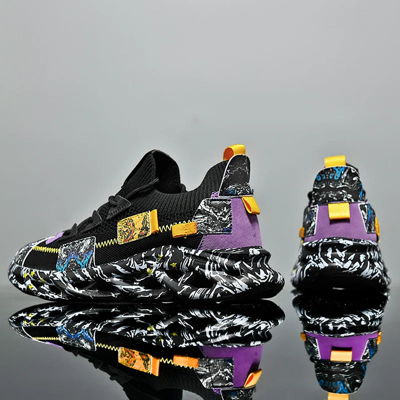 VaultHaus men's luxury sneakers in black with colorful patchwork and bold patterned sole