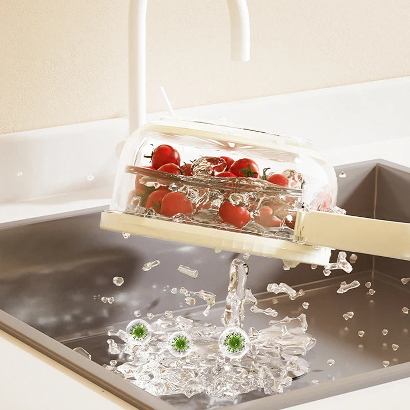 VaultHaus multi-function fruit and vegetable strainer basket rinsing cherry tomatoes over kitchen sink