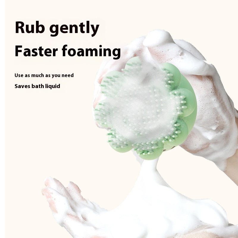 VaultHaus Dog Silicone Shower Brush in green creating rich foam on hands for gentle pet bathing