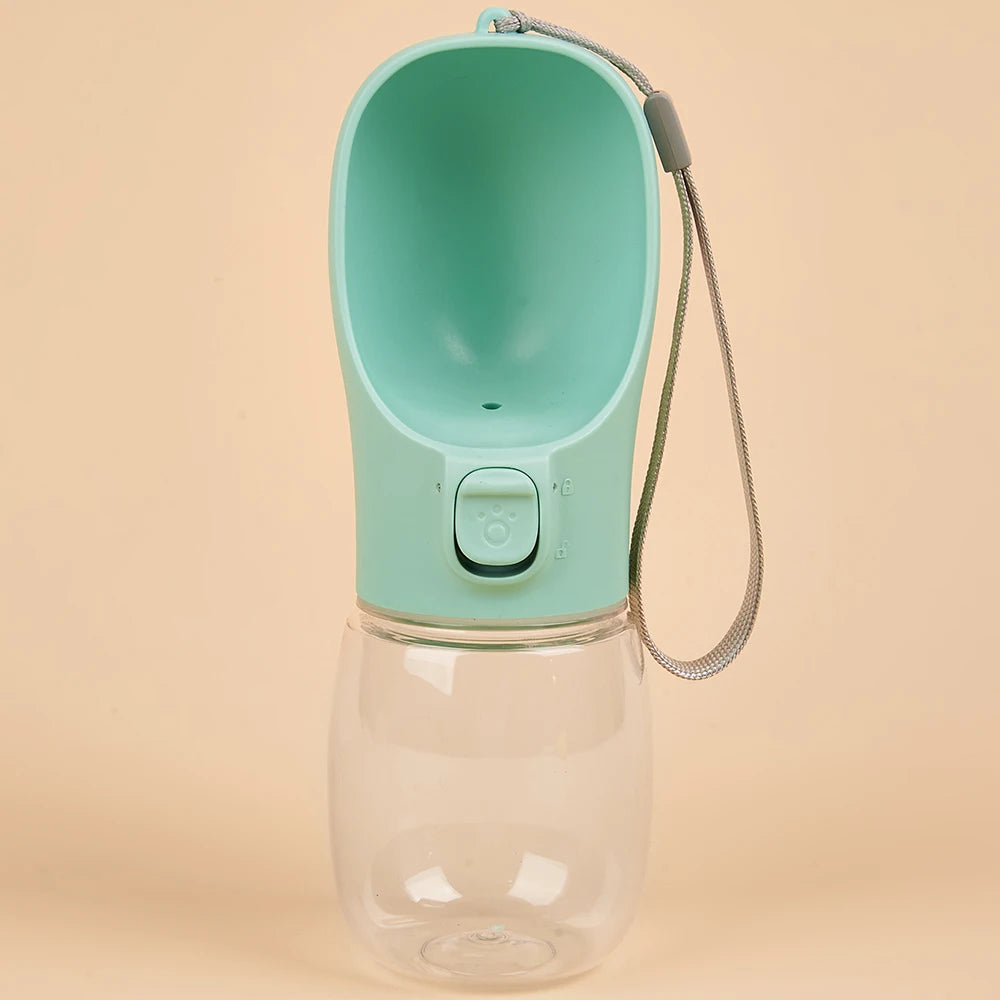 VaultHaus portable dog water bottle in mint green with attached wrist strap for easy carrying