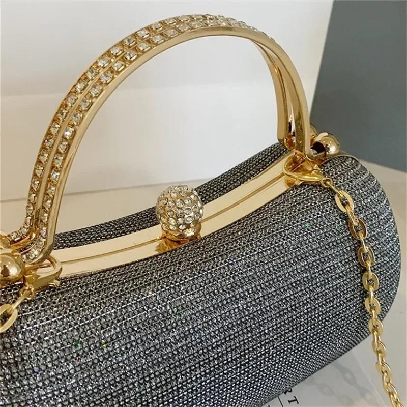 VaultHaus rhinestone evening bag with a gold handle and sparkling embellishments for elegant occasions