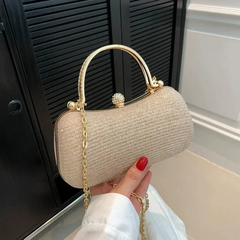 Stylish VaultHaus rhinestone evening bag with a gold chain and elegant clasp design