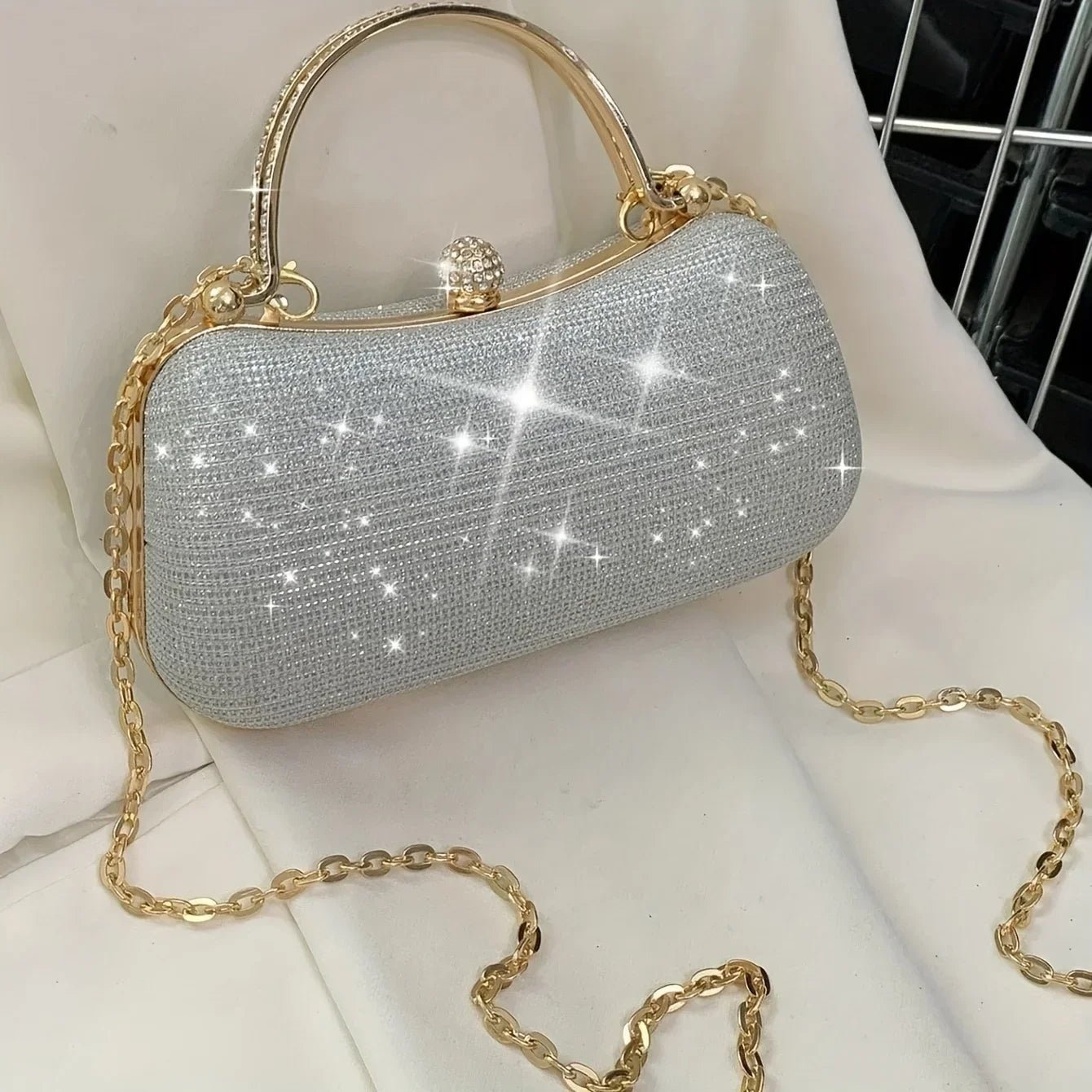 Stylish rhinestone evening bag with gold chain and sparkling surface for elegant occasions