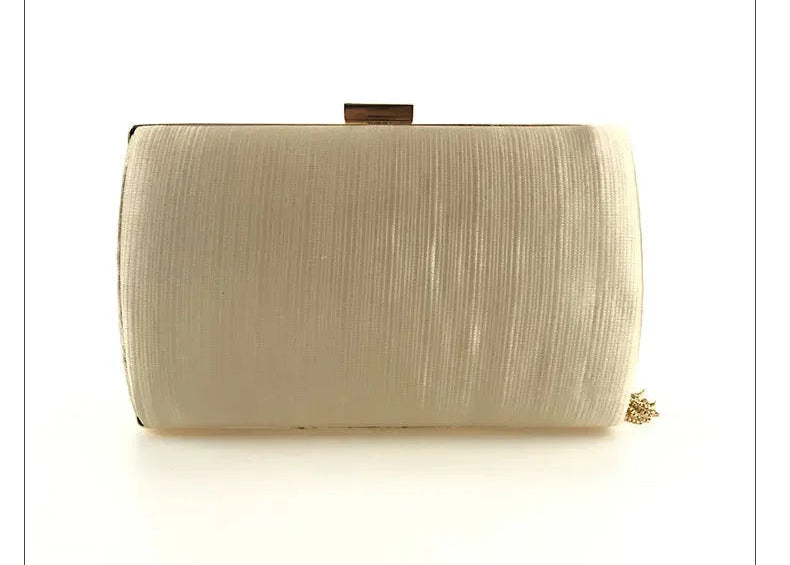 Elegant cream-colored tassel evening clutch purse with a sleek design for formal occasions