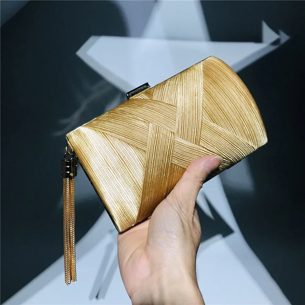 Elegant gold tassel evening clutch purse with a stylish woven design for formal occasions
