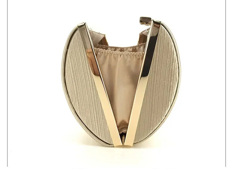 Elegant tassel evening clutch purse in gold with a chic oval shape and metallic frame for formal events