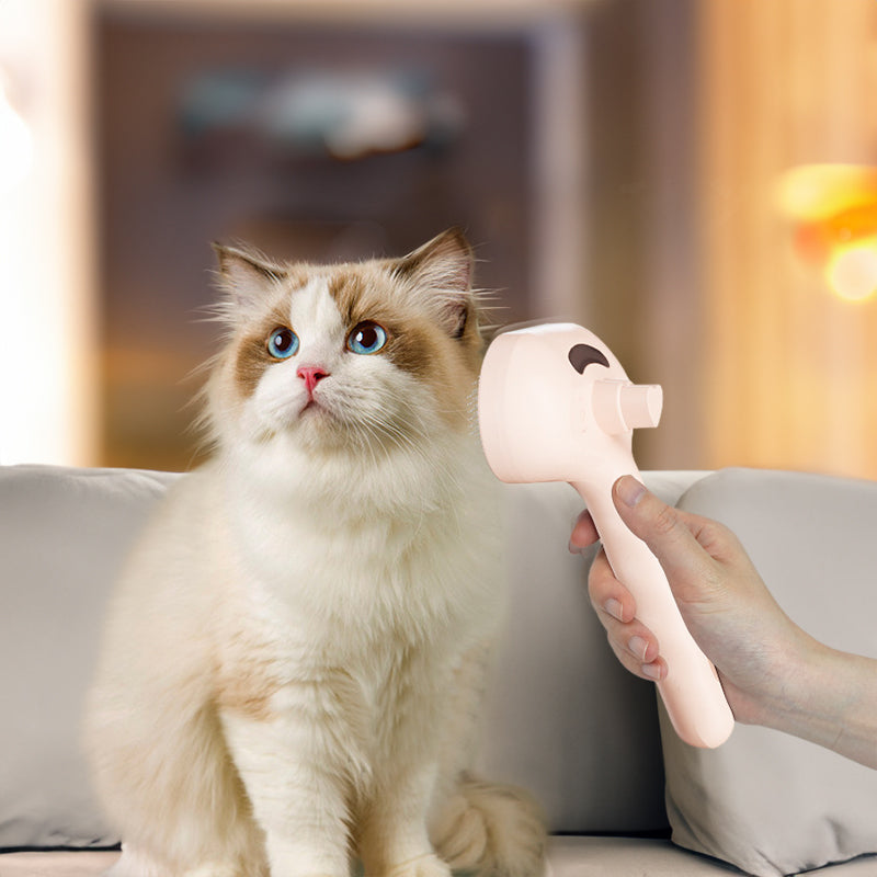 eprolo Upgraded Pet Electric Grooming Comb being used on a fluffy white and brown cat indoors