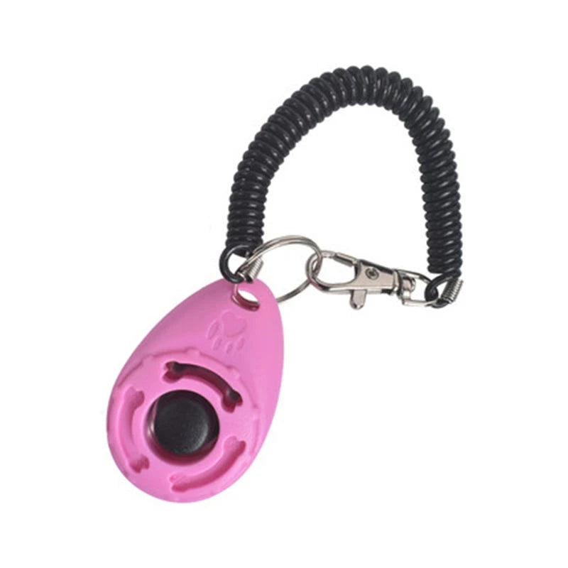 Pink dog training clicker with a keychain clip and coiled strap for effective pet training